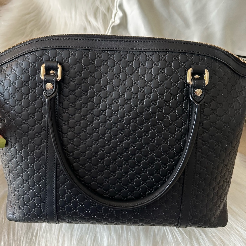 Authentic Black soft microguccissima small Gucci zippered tote great for work.